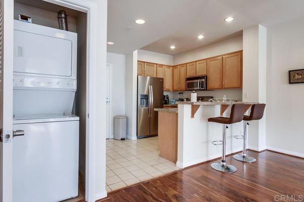 Interior, Kitchen, Recessed Lighting, Washer, Wood Texture Flooring
