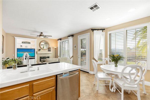 Dining room, Fireplace, Interior, Kitchen, Recessed Lighting, Stainless Steel Appliances, Tile Countertops