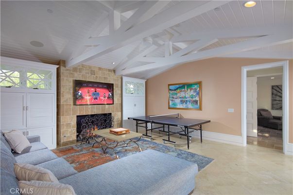 Fireplace, Game Room, Interior, Living room, Recessed Lighting, Stone Walls