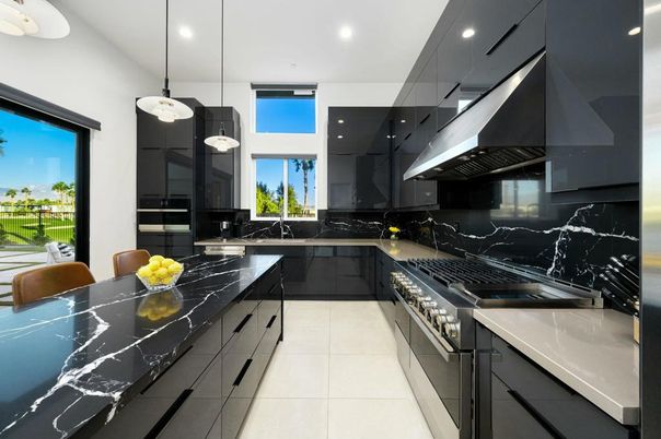 Interior, Kitchen, Marble Walls, Pendant Lights, Recessed Lighting, Stainless Steel Appliances