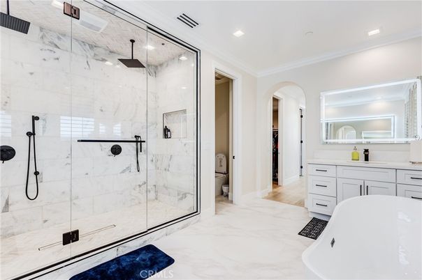 Bathroom, Free Standing Baths, Glass Shower, Interior, Marble, Marble Walls, Recessed Lighting, Wood Texture Flooring