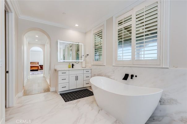Bathroom, Dual Sink Vanities, Free Standing Baths, Interior, Marble, Recessed Lighting, Wood Texture Flooring