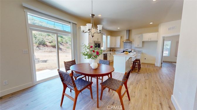 Chandelier, Dining room, Interior, Kitchen, Recessed Lighting, Stainless Steel Appliances, Wood Texture Flooring