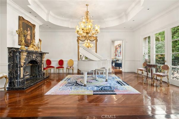 Chandelier, Fireplace, Interior, Piano, Recessed Lighting, Wood Texture Flooring