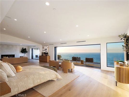 Bedroom, Fireplace, Interior, Recessed Lighting, Water, Wood Texture Flooring