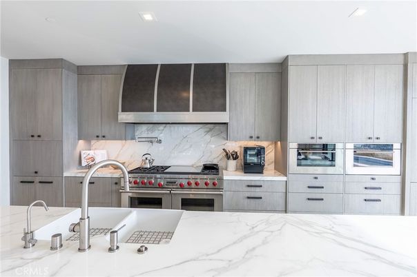 Interior, Kitchen, Marble Walls, Recessed Lighting, Stainless Steel Appliances