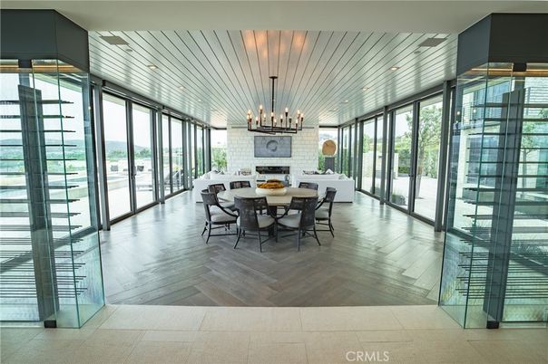Dining room, Fireplace, Interior, Pendant Lights, Stone Walls, Wood Texture Flooring
