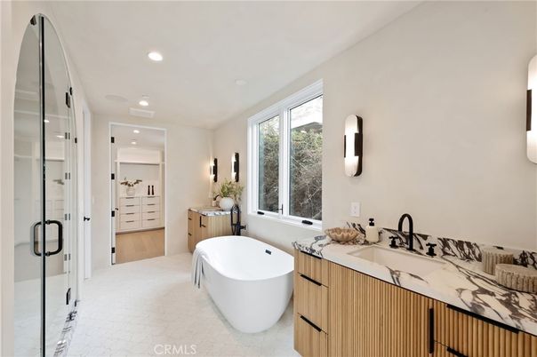 Bathroom, Dual Sink Vanities, Free Standing Baths, Glass Shower, Interior, Recessed Lighting, Wood Texture Flooring