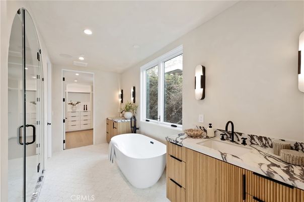 Bathroom, Dual Sink Vanities, Free Standing Baths, Glass Shower, Interior, Recessed Lighting, Wood Texture Flooring