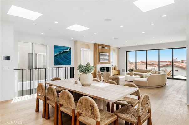 Dining room, Fireplace, Interior, Living room, Recessed Lighting, Water, Wood Texture Flooring