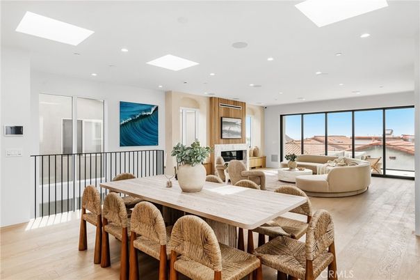 Dining room, Fireplace, Interior, Living room, Recessed Lighting, Water, Wood Texture Flooring