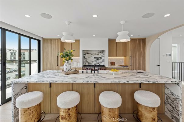 Interior, Kitchen, Marble Walls, Pendant Lights, Recessed Lighting, Stainless Steel Appliances