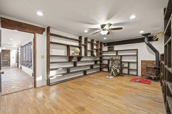 Fireplace, Fitness Equipment, Interior, Recessed Lighting, Stone Walls, Wood Texture Flooring