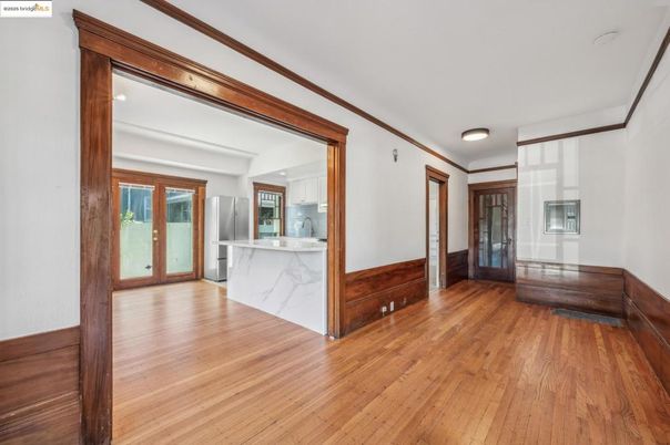 Empty room, Interior, Kitchen, Recessed Lighting, Stainless Steel Appliances, Wood Texture Flooring