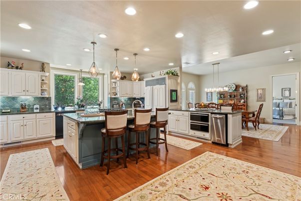 Dining room, Interior, Kitchen, Pendant Lights, Recessed Lighting, Stainless Steel Appliances, Wood Texture Flooring
