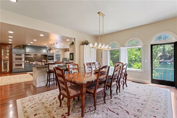 Chandelier, Dining room, Interior, Kitchen, Pendant Lights, Recessed Lighting, Stainless Steel Appliances, Wood Texture Flooring