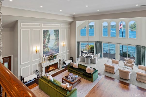 Dining room, Fireplace, Interior, Living room, Recessed Lighting, Water, Wood Texture Flooring