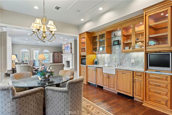 Chandelier, Dining room, Fireplace, Interior, Kitchen, Living room, Recessed Lighting, Wood Texture Flooring