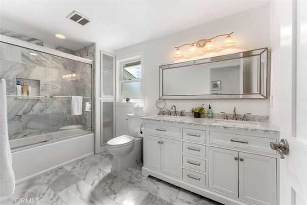 Bathroom, Dual Sink Vanities, Glass Shower, Interior, Marble, Marble Walls, Recessed Lighting