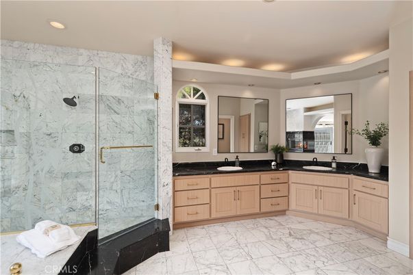 Bathroom, Dual Sink Vanities, Glass Shower, Interior, Marble, Marble Walls, Recessed Lighting