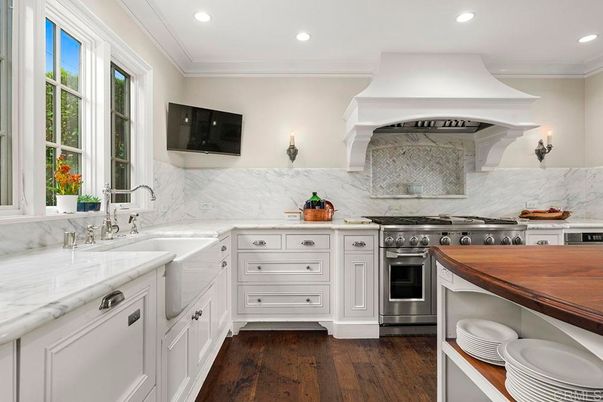 Interior, Kitchen, Marble Walls, Recessed Lighting, Stainless Steel Appliances, Wood Texture Flooring