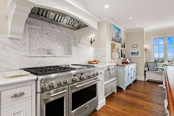 Interior, Kitchen, Marble Walls, Recessed Lighting, Stainless Steel Appliances, Wood Texture Flooring