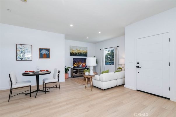 Dining room, Fireplace, Interior, Living room, Recessed Lighting, Wood Texture Flooring