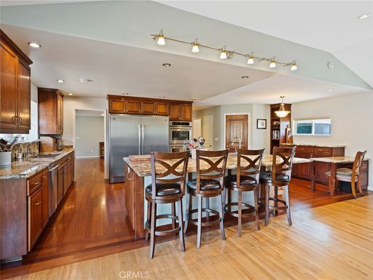 Dining room, Interior, Kitchen, Pendant Lights, Recessed Lighting, Stainless Steel Appliances, Wood Texture Flooring