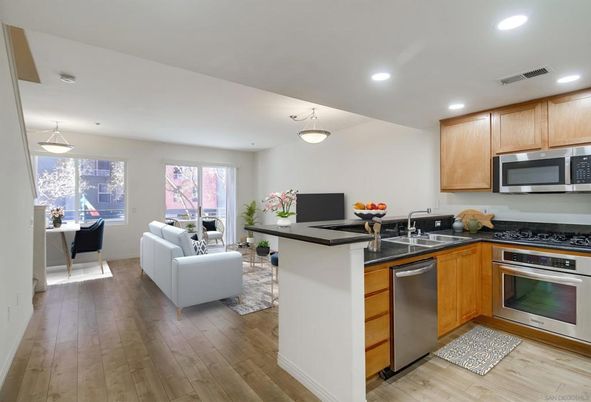 Dining room, Interior, Kitchen, Living room, Pendant Lights, Recessed Lighting, Stainless Steel Appliances, Wood Texture Flooring