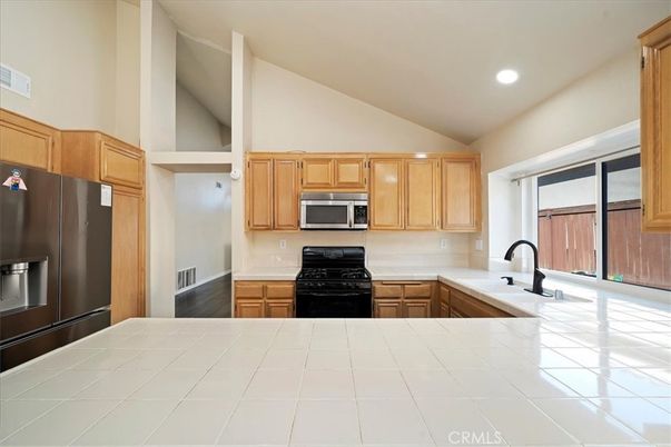 Interior, Kitchen, Recessed Lighting, Tile Countertops, Wood Texture Flooring