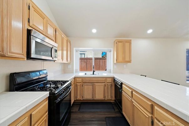 Interior, Kitchen, Recessed Lighting, Tile Countertops, Wood Texture Flooring