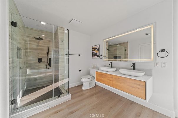 Bathroom, Dual Sink Vanities, Glass Shower, Interior, Recessed Lighting, Wood Texture Flooring