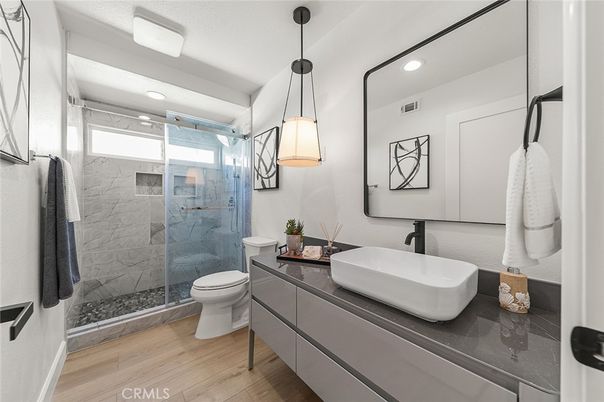Bathroom, Glass Shower, Interior, Pendant Lights, Recessed Lighting, Wood Texture Flooring