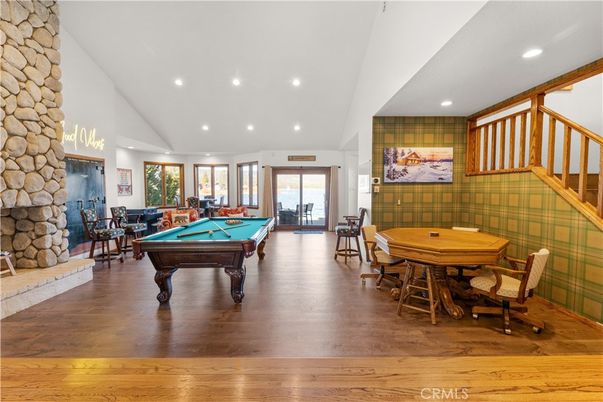 Billiard Table, Fireplace, Game Room, Interior, Recessed Lighting, Stone Walls, Wood Texture Flooring