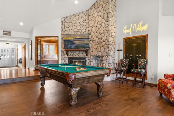Billiard Table, Fireplace, Game Room, Interior, Recessed Lighting, Stone Walls, Wood Texture Flooring