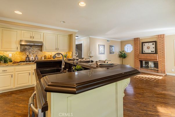 Fireplace, Interior, Kitchen, Recessed Lighting, Stone Walls, Wood Texture Flooring
