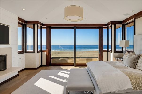 Bedroom, Fireplace, Interior, Pendant Lights, Recessed Lighting, Water, Wood Texture Flooring