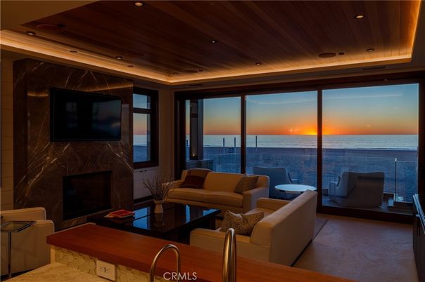 Fireplace, Interior, Living room, Marble Walls, Recessed Lighting, Water, Wooden Ceilings