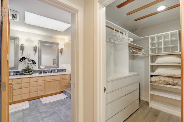 Bathroom, Dual Sink Vanities, Interior, Recessed Lighting, Walk-in Closets, Wood Texture Flooring