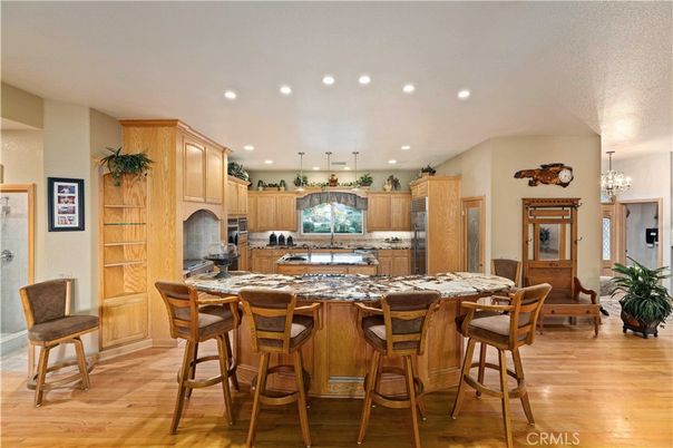 Chandelier, Dining room, Interior, Kitchen, Recessed Lighting, Stainless Steel Appliances, Wood Texture Flooring
