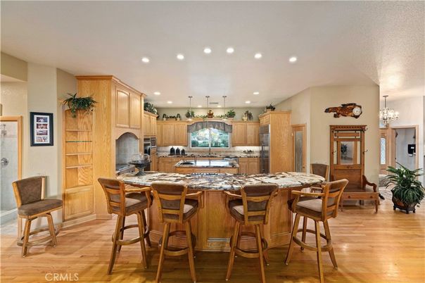 Chandelier, Dining room, Interior, Kitchen, Recessed Lighting, Stainless Steel Appliances, Wood Texture Flooring