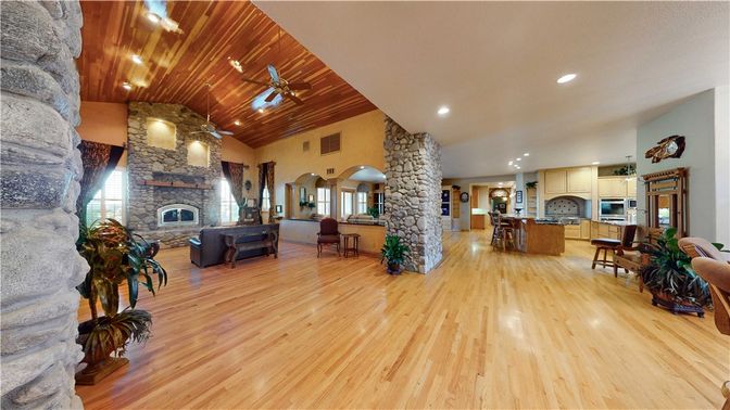 Dining room, Fireplace, Interior, Kitchen, Living room, Recessed Lighting, Stainless Steel Appliances, Stone Walls, Wooden Ceilings, Wood Texture Flooring