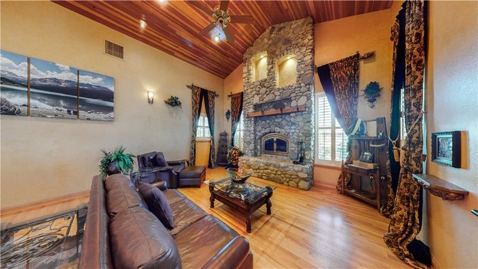 Fireplace, Interior, Living room, Recessed Lighting, Stone Walls, Wood Texture Flooring