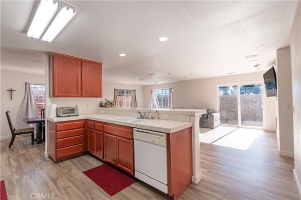 Interior, Kitchen, Recessed Lighting, Tile Countertops, Wood Texture Flooring