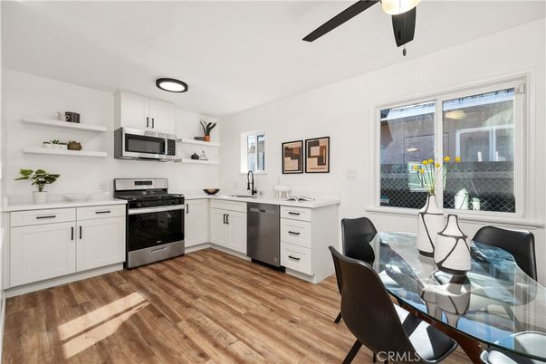 Dining room, Interior, Kitchen, Recessed Lighting, Stainless Steel Appliances, Wood Texture Flooring