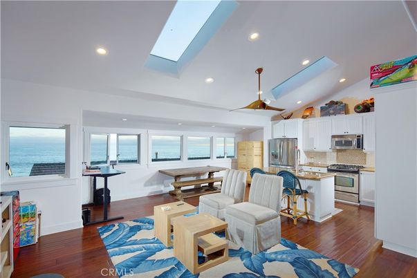 Dining room, Interior, Kitchen, Living room, Recessed Lighting, Stainless Steel Appliances, Water, Wood Texture Flooring