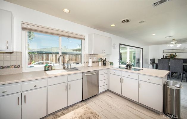 Dining room, Interior, Kitchen, Recessed Lighting, Stainless Steel Appliances, Wood Texture Flooring