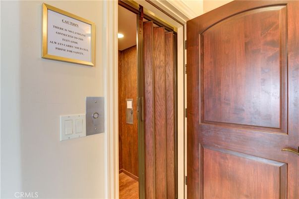 Elevator, Interior, Recessed Lighting, Wood Texture Flooring