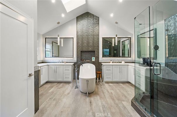 Bathroom, Dual Sink Vanities, Free Standing Baths, Glass Shower, Interior, Recessed Lighting, Wood Texture Flooring