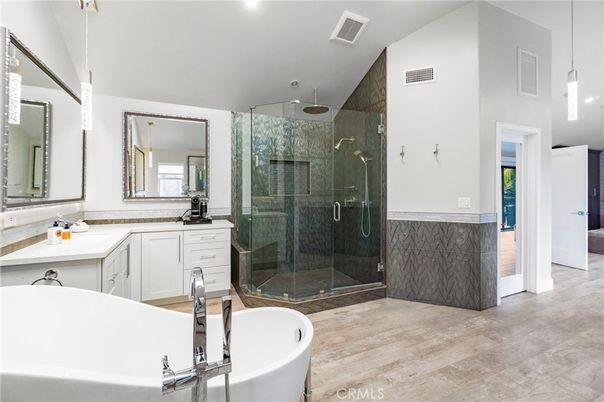 Bathroom, Dual Sink Vanities, Free Standing Baths, Glass Shower, Interior, Pendant Lights, Recessed Lighting, Wood Texture Flooring